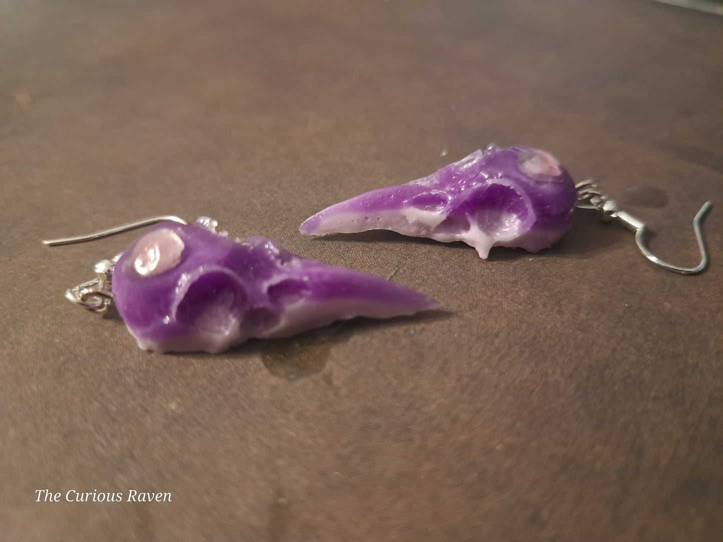 Lavender Glow in the Dark Raven Skull Earrings