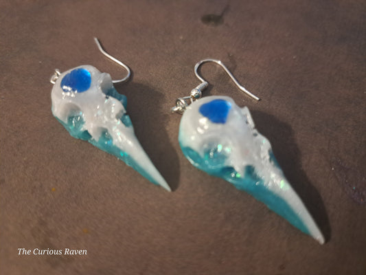 Pearl and Blue Glow in the Dark Resin Raven Skull Earrings