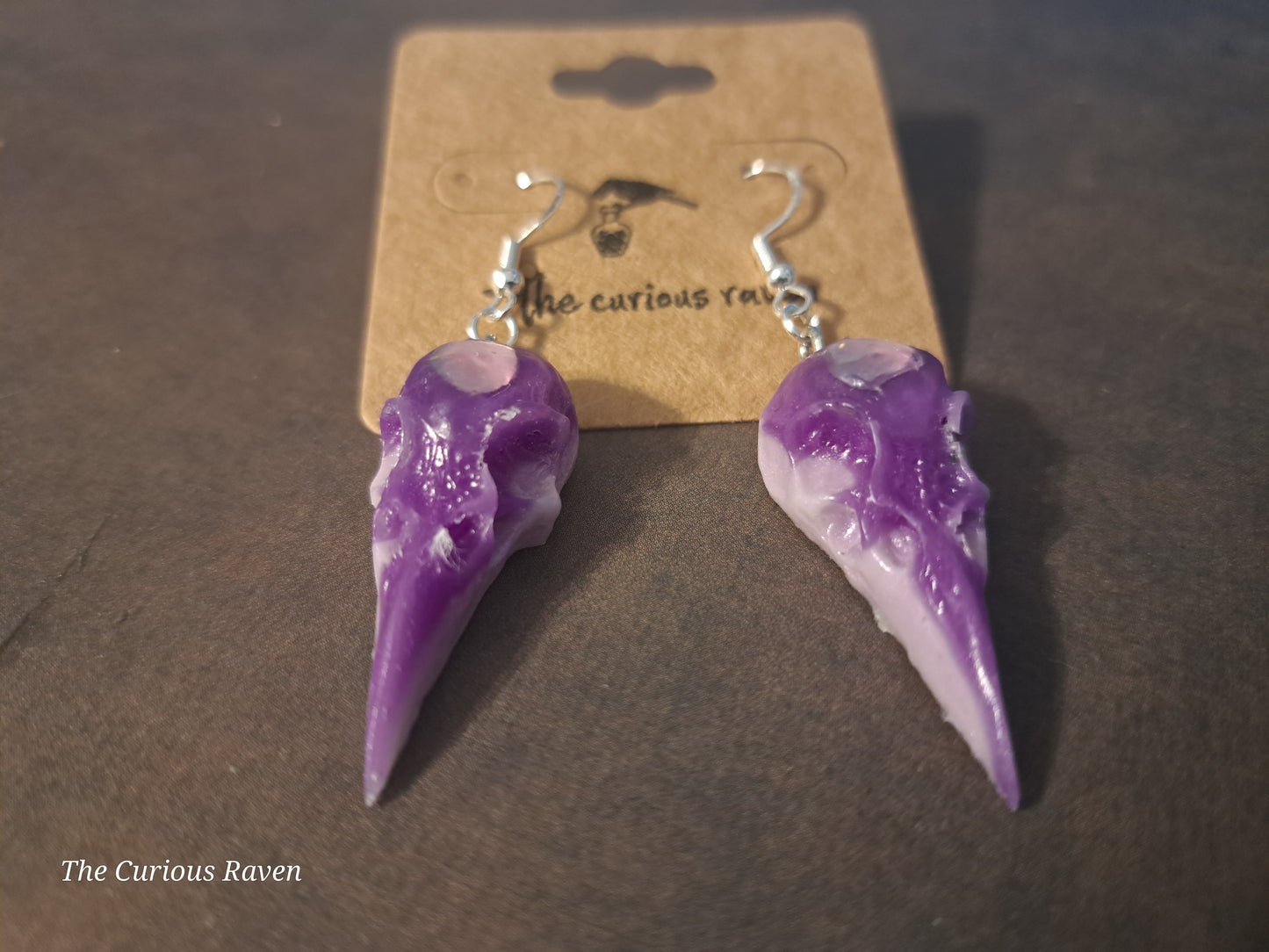 Lavender Glow in the Dark Raven Skull Earrings