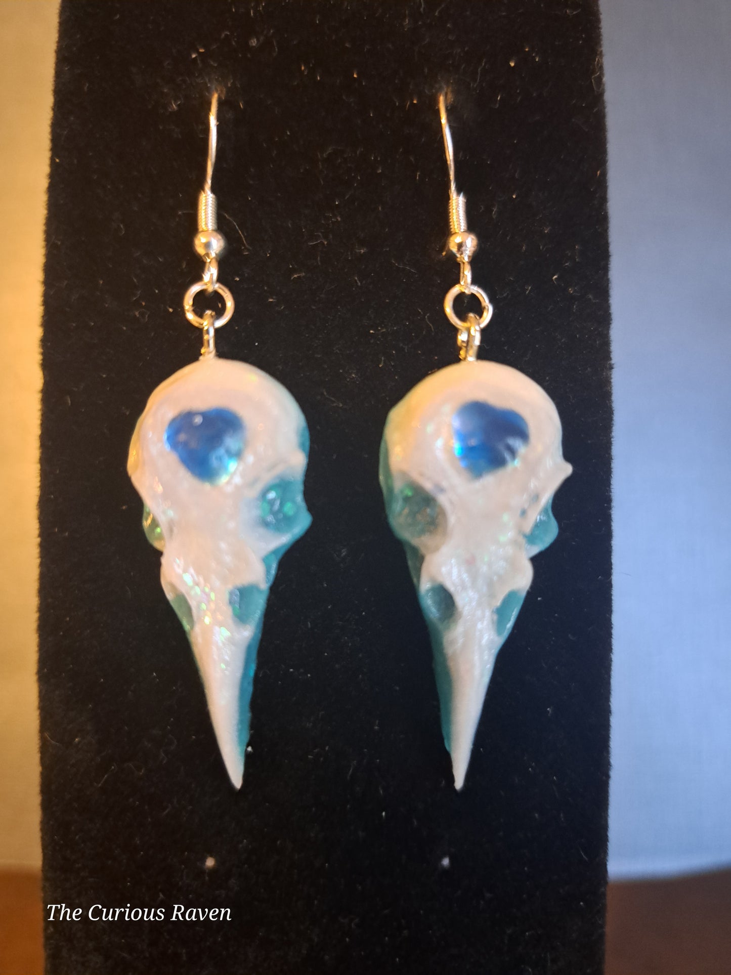 Pearl and Blue Glow in the Dark Resin Raven Skull Earrings