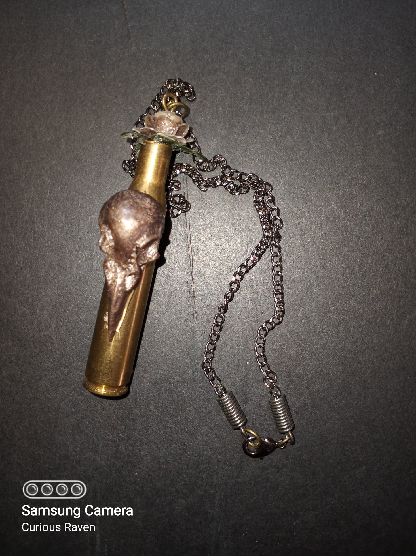 Rose and raven shell casing necklace