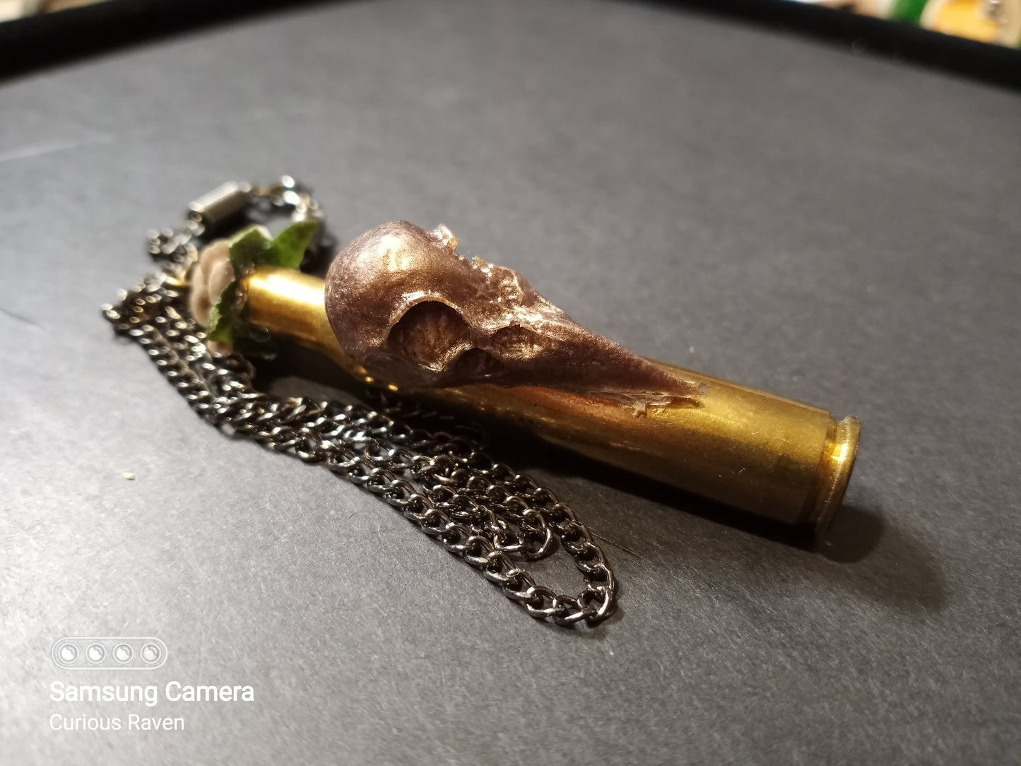 Rose and raven shell casing necklace