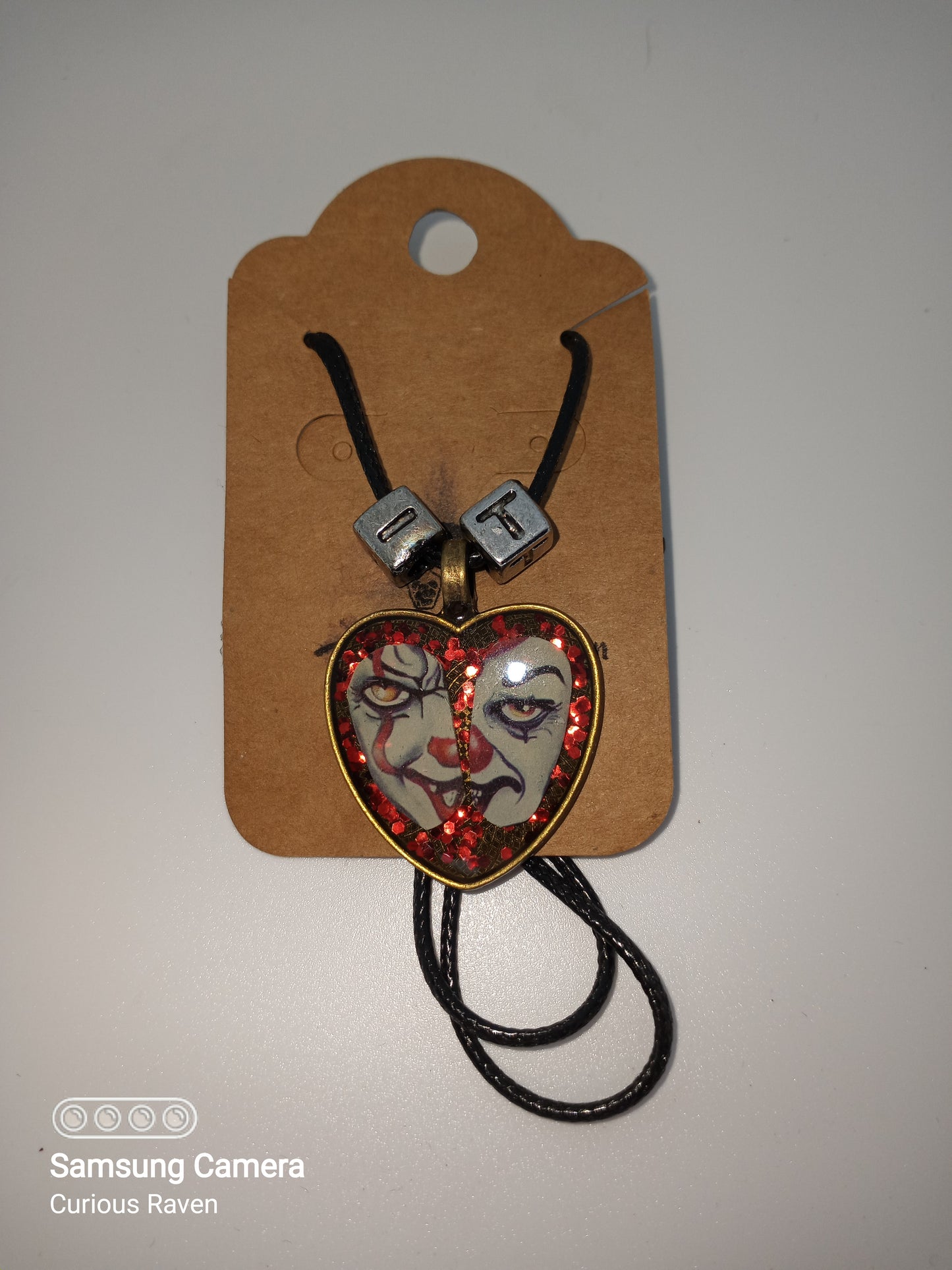 Pennywise resin heart necklace